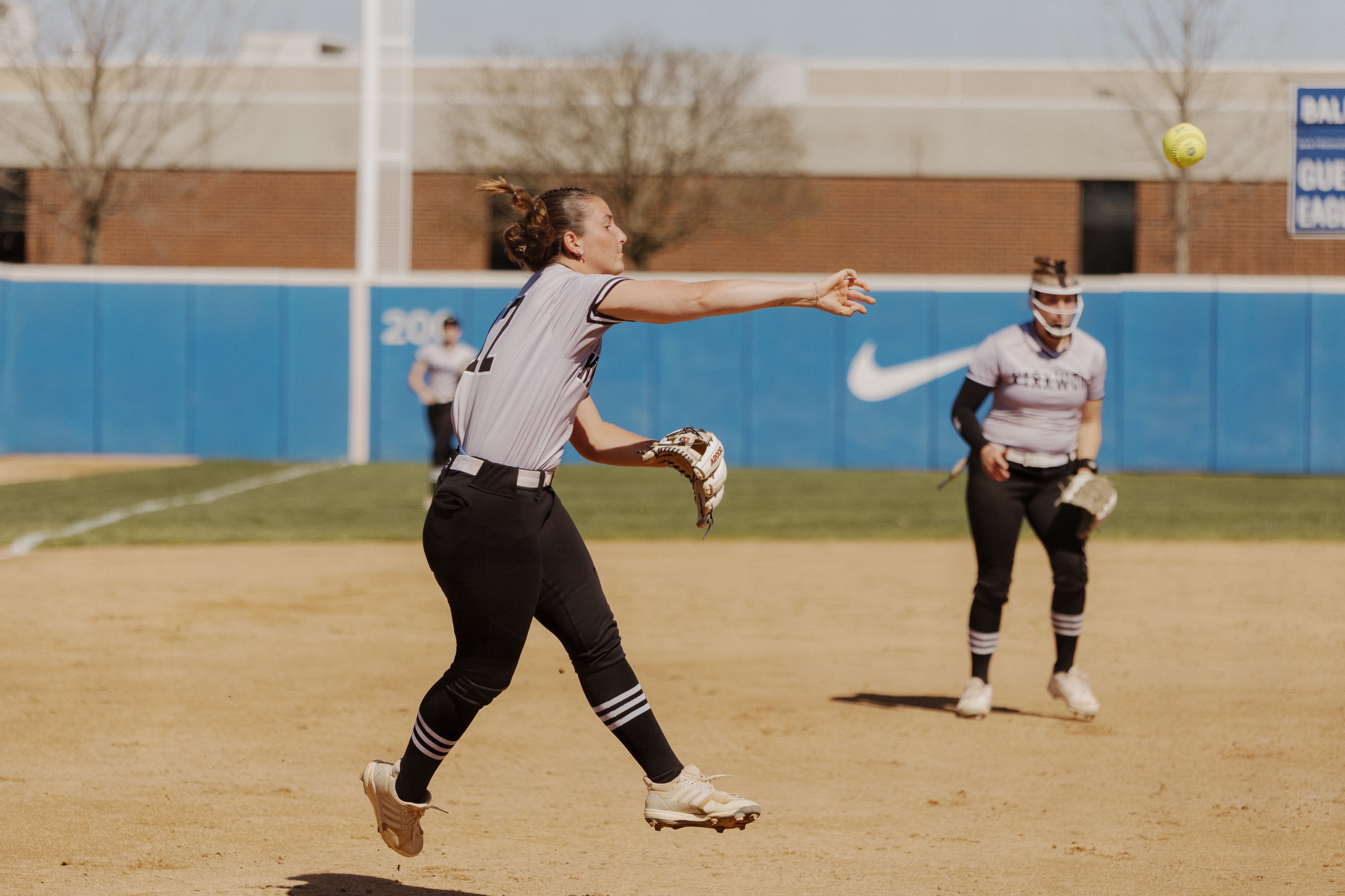 Kirkwood Softball player throwing the ball 